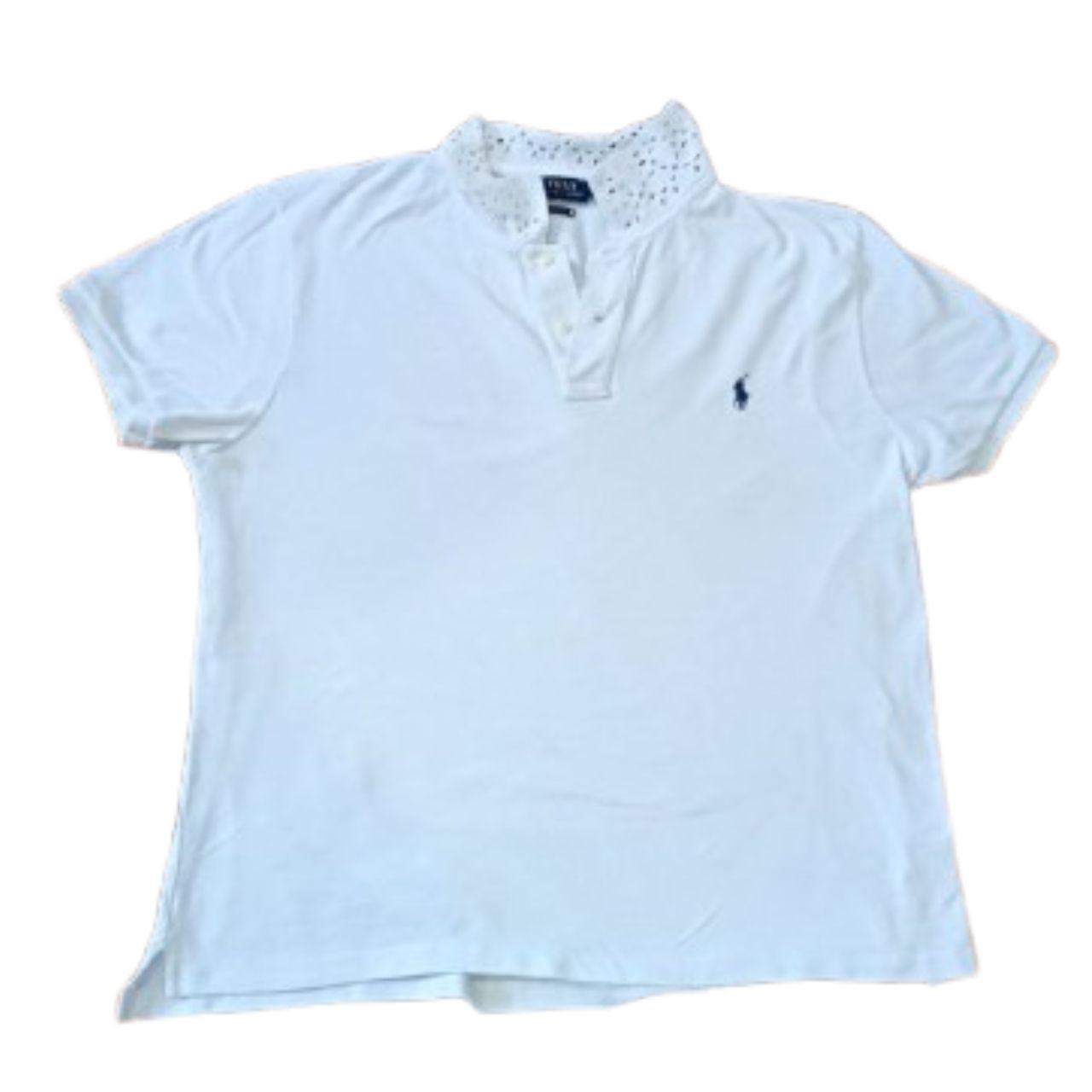 White polo shirt with a small logo on a white background